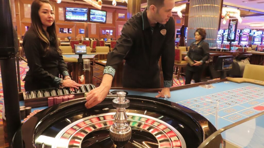 people wearing black playing casino games
